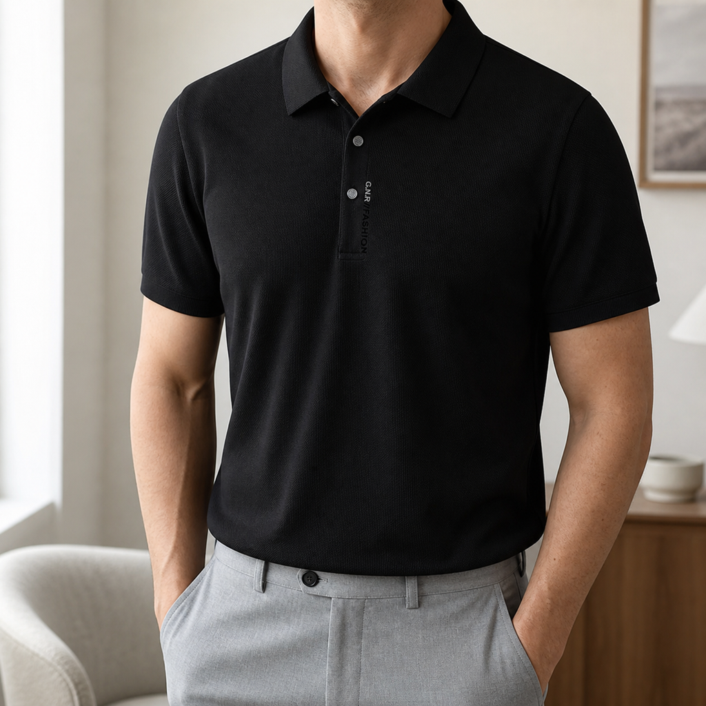 Man wearing the black Arzadea crease-resistant knit polo with grey trousers